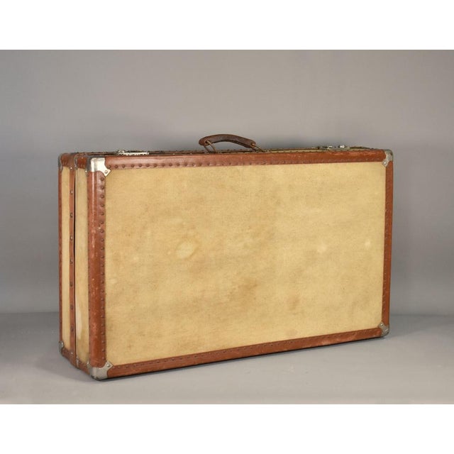 French Antique Steamer Trunk Suitcase A sturdy Steamer Trunk / Travelling Suitcase that features reinforced corner...