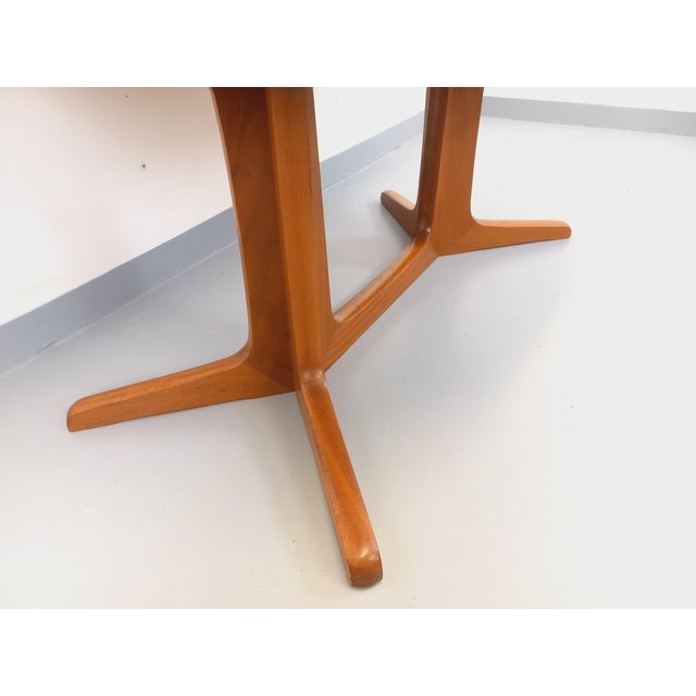 Vintage dining table from the 1960s/70s, by the French manufacturer Baumann, in a Scandinavian style with an oval shape, a...