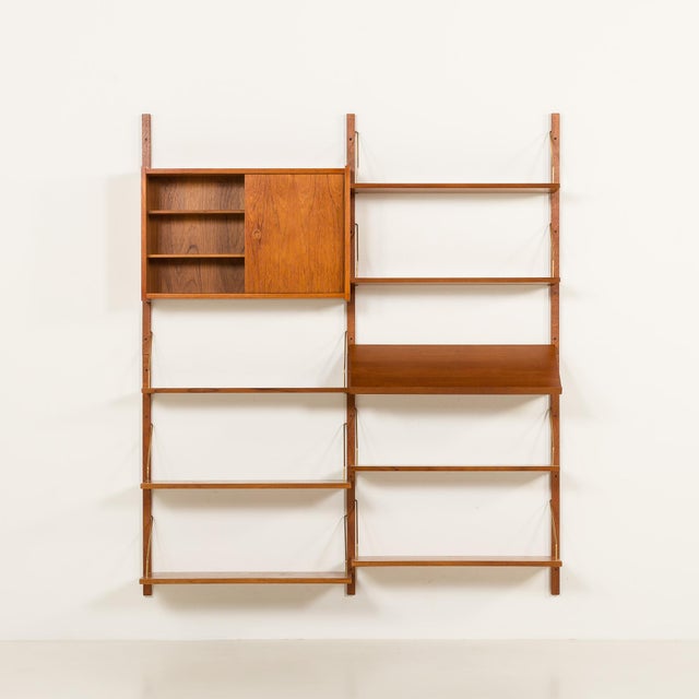 This danish teak shelving unit is reminiscent of the iconic 1960s modular furniture designed by poul cadovius and was...