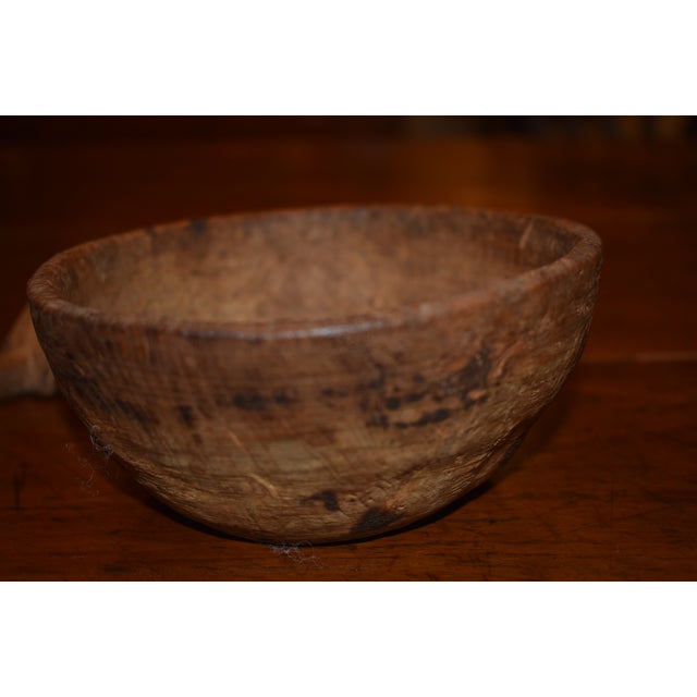 18th or early 19th century turned burlwood bowl, probably American in origin. A burl scraping tool is also included in...