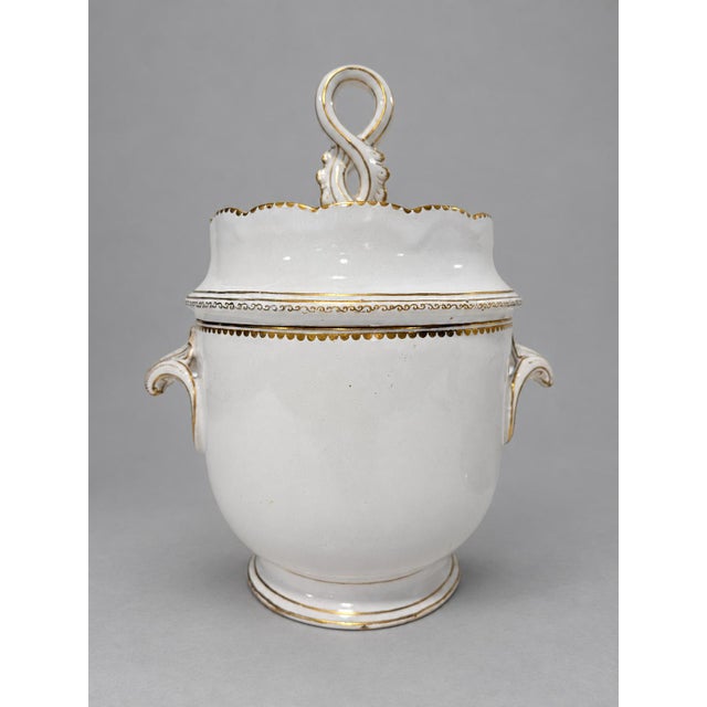 A fine pair of covered porcelain ice pails, or seaux à glace, in the French Old Paris taste, each modeled with a rounded...