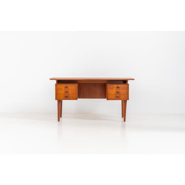 Large writing desk (Denmark, 1960s). A beautifully crafted freestanding writing desk, dating to the 1960s. The design...