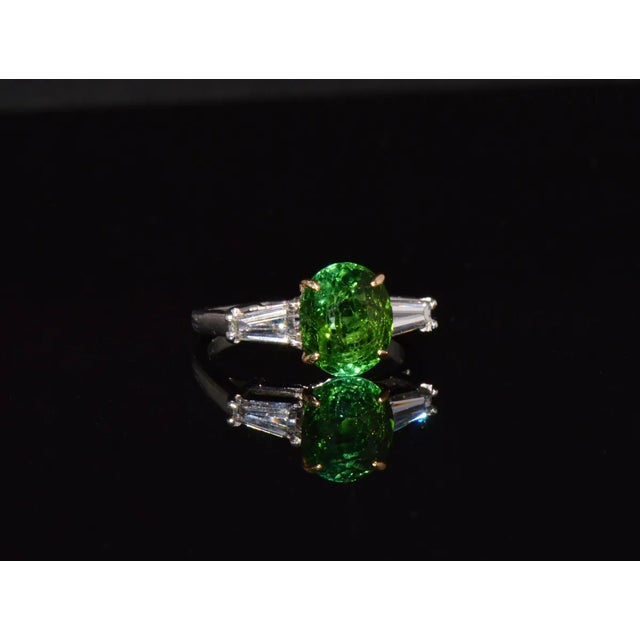 Gorgeous 3.85CTS diamond and tourmaline solid platinum 18K gold three stone ring. This is a top quality neon green...