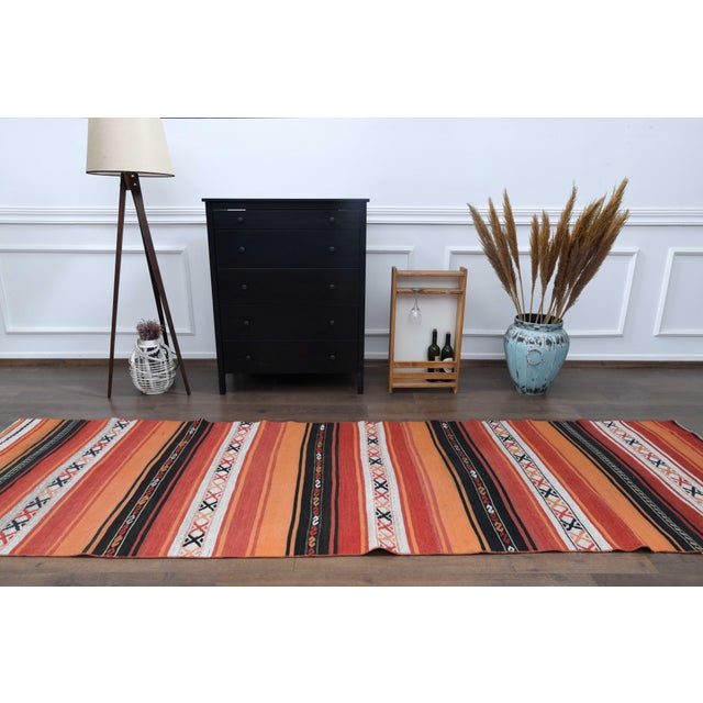 Vintage Hand-Knotted Kilim Runner rug is a semi-antique vintage runner rug. The '70s Eastern region of Anatolian's unique...