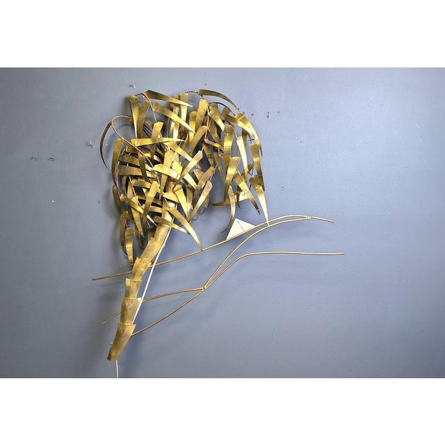 Beautiful post-modern palm tree wall sculpture with light signed by Daniel D'Haeseleer. The sculpture has a regular E14...