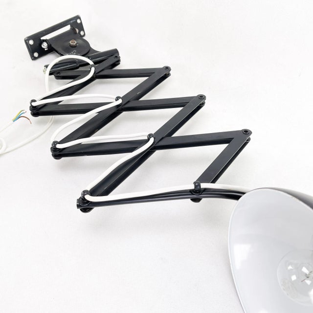 The scissor lamp is an original designer classic from the 30s. Kaiser Idell lamp is a design by Christian Dell. The lamp...