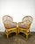 Vintage pair of bamboo/rattan fan back arm chairs. Made in Philippines. Pencil reed backs with triple band trim around...