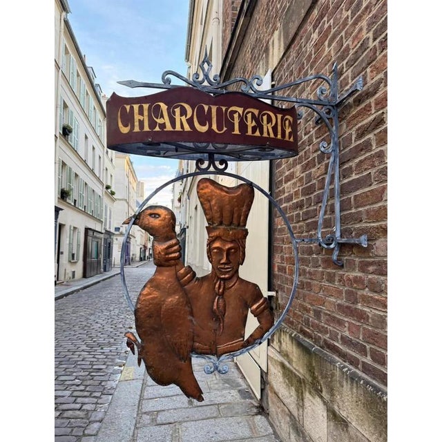 This antique sign, with its exceptional dimensions (190 cm tall), is a one-of-a-kind piece. It consists of a wrought-iron...