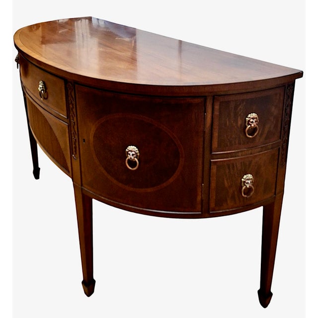 On offer is an American Federal-style mahogany demilune sideboard, a piece handsome enough in proportions and detailing to...