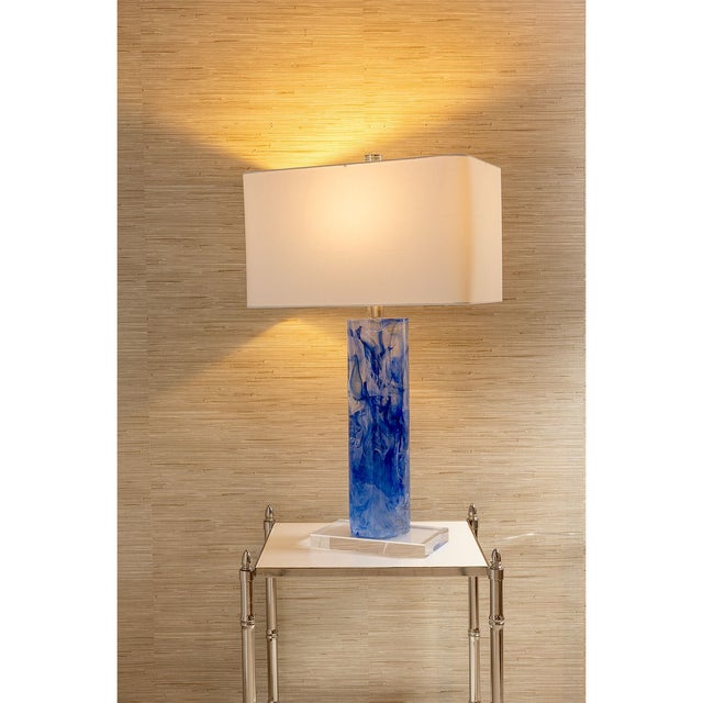 Our Oceanic lamp is a celebrated unexpected collision of blue color with this modern cylindrical shape. This hand poured...