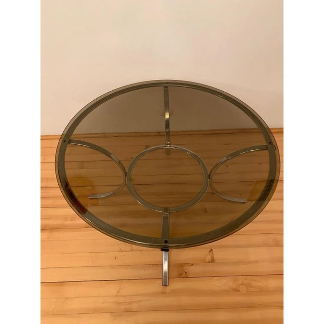 French coffee table from the '70s In original condition and in good condition. The base is made of chromed metal and the...