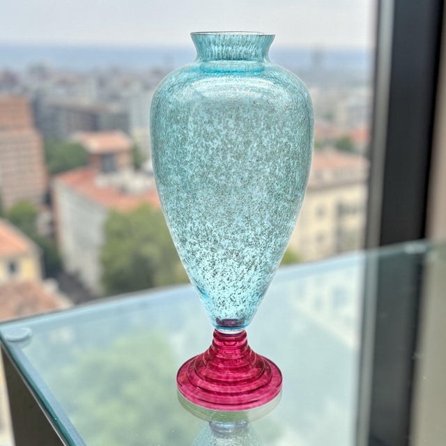 A striking late 20th-century Italian art glass vase executed in a tall baluster form, combining a finely controlled bubble...