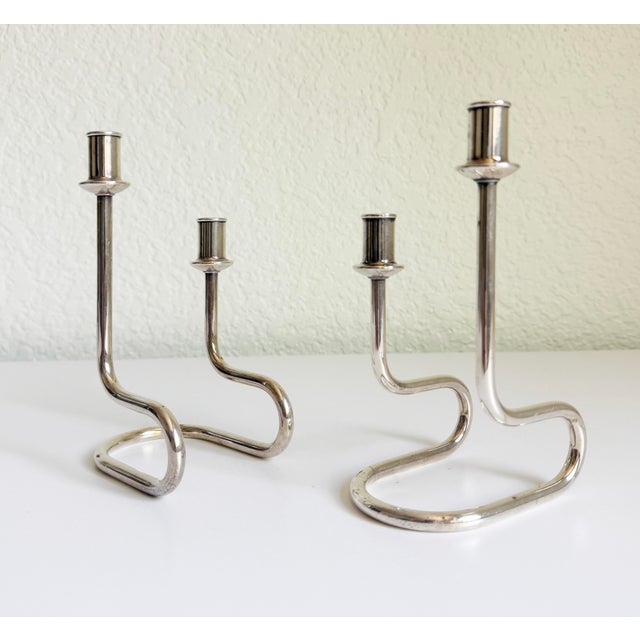 A sleek pair of vintage mid-century modernist candle holders designed by Gorham Maestri in Italy. Produced in the 1950s to...