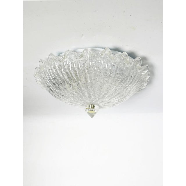 Textured molded glass ceiling light, France, 20th century. This elegant French ceiling light, crafted from clear molded...