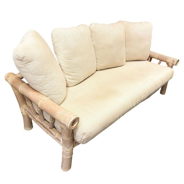 Restored 1980s Miami-style 2-piece living room set featuring a 3-person oversized bamboo pole sofa and lounge chair. The...