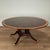 Impressive large dining table crafted in mahogany in classic regency style, having a round top with satin wood cross...
