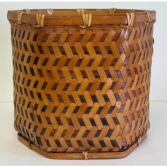 Vintage angular woven wicker basket framed in solid bamboo with striking herringbone pattern to frame. Top and bottom...