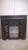 A magnificent original antique cast iron fireplace insert retaining its beautiful original decorative ceramic tiles,...