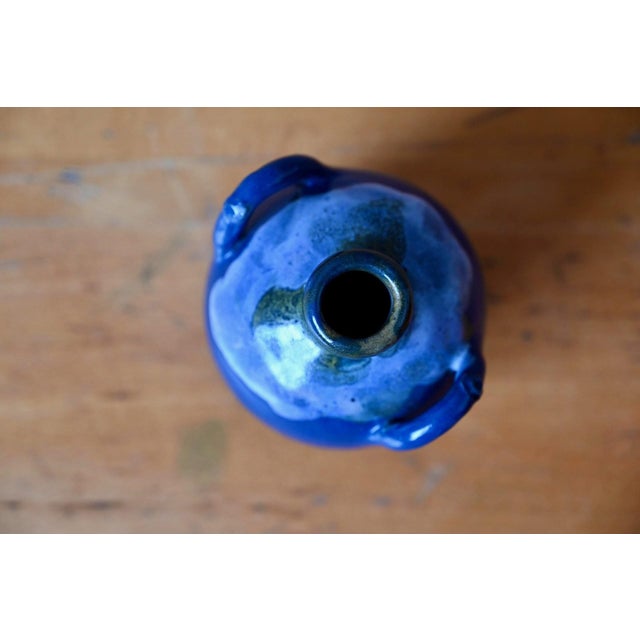 Simply captivating, this small glazed stoneware vase by Léon Pointu radiates a tranquil beauty typical of early 20th-...