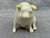 Sweet vintage ivory Belleek porcelain pig with pale yellow ears. Marked on the bottom. Pig measures 4" by 2" by 3".