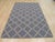 This blue wool rug features a durable flat weave construction consistent with Kilim style floor coverings. It offers a...