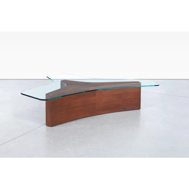 Designed by Harvey Probber and manufactured in the United States during the 1960s, this biomorphic coffee table is a...