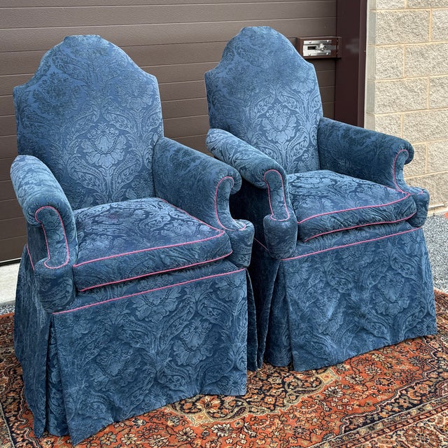 A pair of vintage Baker Furniture William and Mary style throne chairs with walnut frames that are custom built for a...