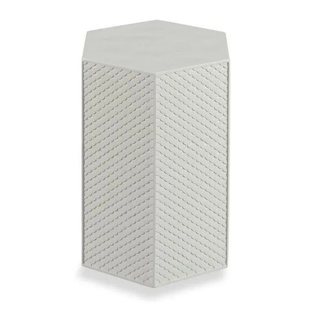 A funky side table for drinks with a hexagon shaped top over 6 sides with a cast fish scale pattern. Care Instructions:...