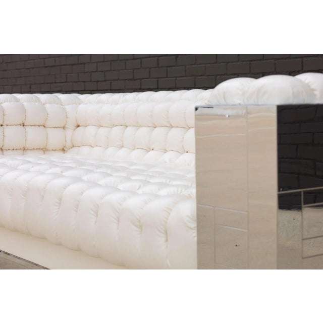 An exceptional pair of Paul Evans biscuit tufted Cityscape sofas, signed and in near mint condition. Finding one is hard,...