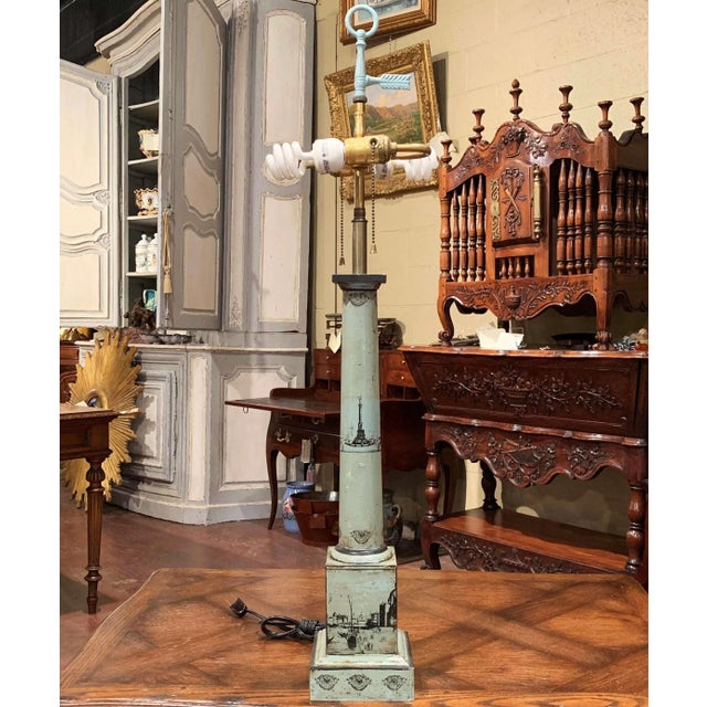 This antique French Directoire-style table lamp features distinctive hand-painted Napoleonic military scenes and a...