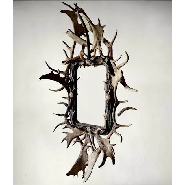 A late 19th century large German antler mirror — a grand rustic trophy-style piece, the kind of statement mirror that...