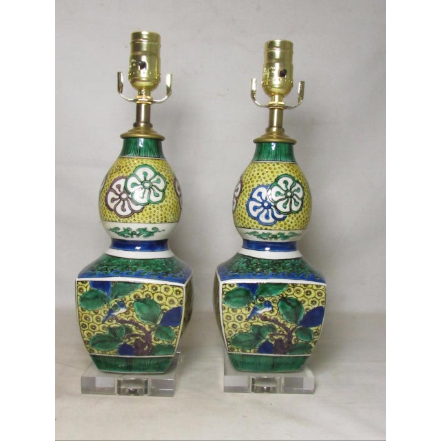 Pair of Japanese porcelain Kutani lamps, c.1950’s A handsome pair of lamps, with an unusually stylish shaped body, having...