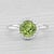 Gemstone Information: - Natural Peridot - Carats - 1.48ct Cut - Round Brilliant Color - Green - Natural Diamonds - Total...