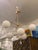 Design Plus Gallery presents the Sphere + Stem Chandelier from West Elm. This modern six-light fixture has a brass-toned...
