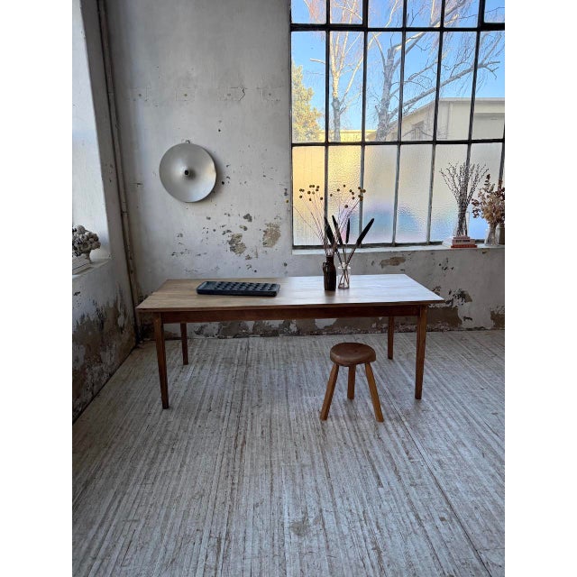 Vintage 1950s farmhouse table in solid oak. We love its airy look with its very slender, tapered legs, giving this table a...
