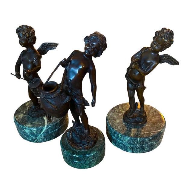 Set of Three Bronze Cherub Sculptures After Auguste Moreau on Serpentine Marble Bases Charming set of three solid bronze...