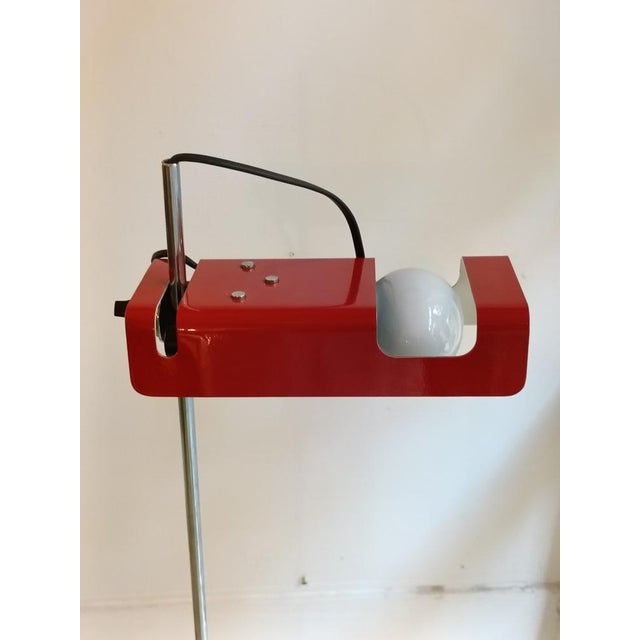 “Spider” floor lamp by Joe Colombo, model no. 3319, in red for Oluce. Crafted from red metal and chrome, it is one of the...