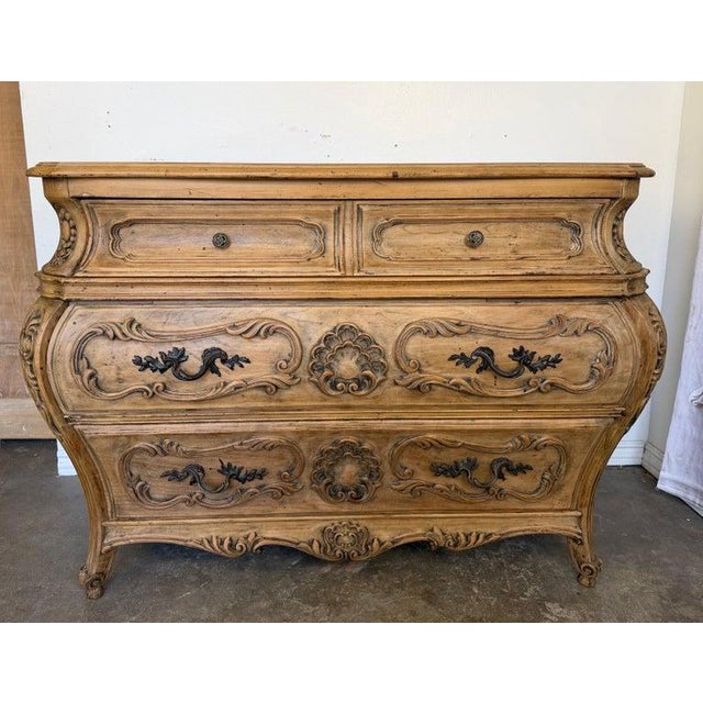 A truly exceptional and highly sculptural French Louis XV Bombé commode, circa early 20th century, recently stripped and...