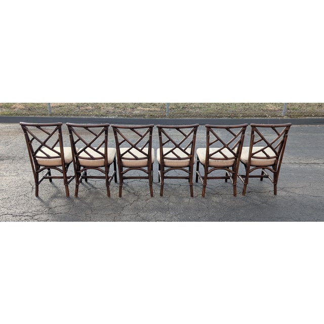 Elevate your dining space with this stunning set of six Chinoiserie Chippendale style chairs by the renowned manufacturer...