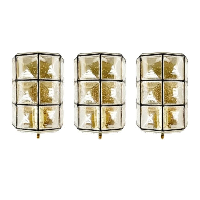 Stunning mid-century modern wall lights/sconces from Limburg (Germany, 1960s). Black square "iron" stripes inlaid in thick...