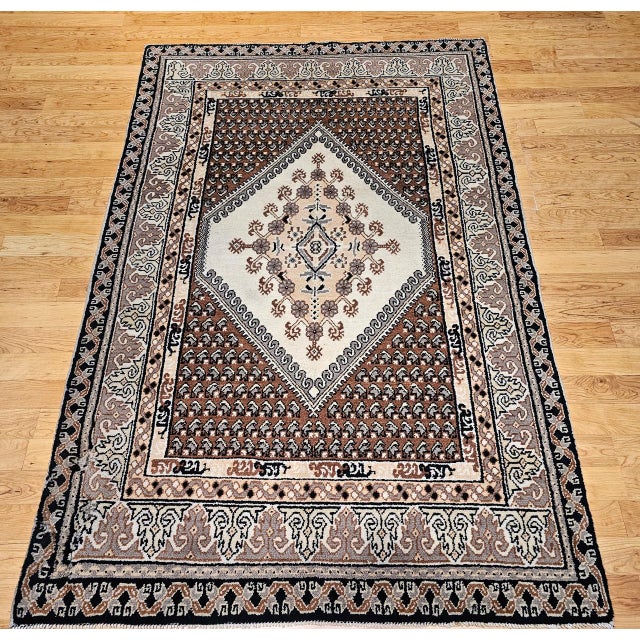 This vintage Moroccan pile rug from the third quarter of the 20th century is a beautifully restrained piece of Berber...