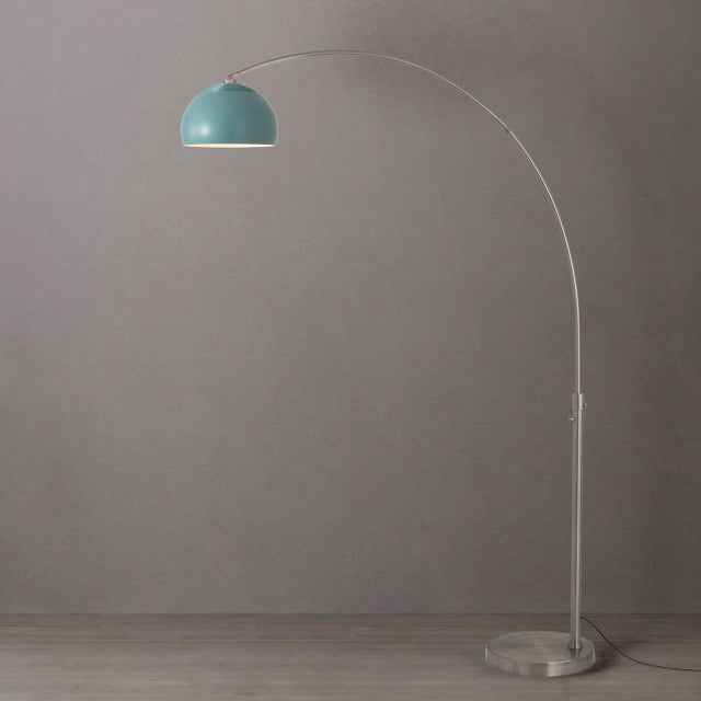 Designed by Peter Morelli in 1960, the Half Dome Arc Lamp is a Modern arc lamp featuring a satin nickel finish and a steel...