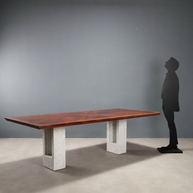 Dining or office table with a large rectangular top in burl veneer and walnut band, and architecturally shaped white...