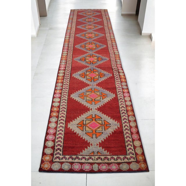 Discover the artistry of this 3x13 ft long runner hand-knotted Oushak rug, a truly unique piece that exudes vintage charm....