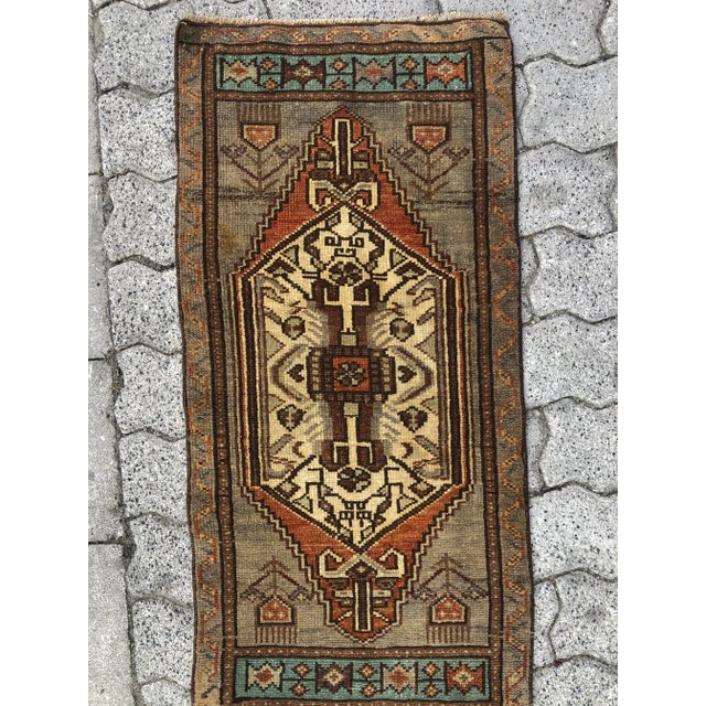 This is a vintage Turkish Oushak rug from the 1960s. The piece was hand-knotted.