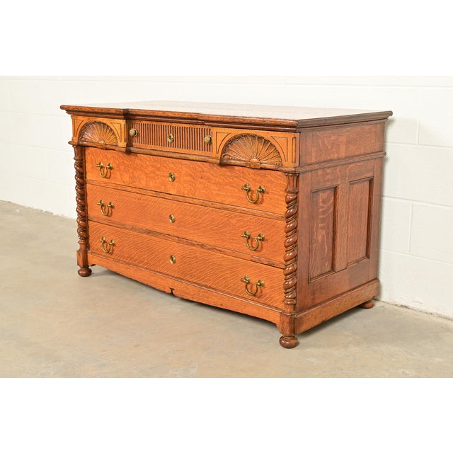 A gorgeous antique Victorian dresser or chest of drawers In the manner of Herter Brothers USA, Circa 1890s Ornately carved...