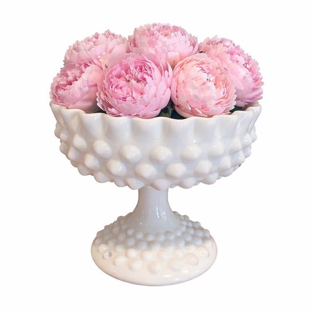 Charming vintage milk glass compote featuring the classic hobnail pattern with a scalloped ruffled rim and pedestal base....