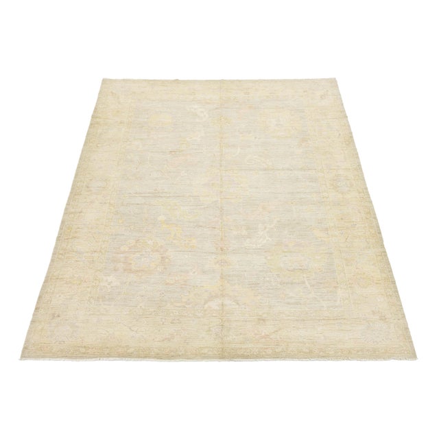 This Modern Oushak style rug showcases a low-contrast palette that embodies contemporary elegance. Hand-knotted from...
