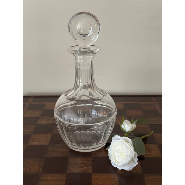 This exquisite 18th-century George III style glass decanter showcases exceptional craftsmanship with its elegant design....