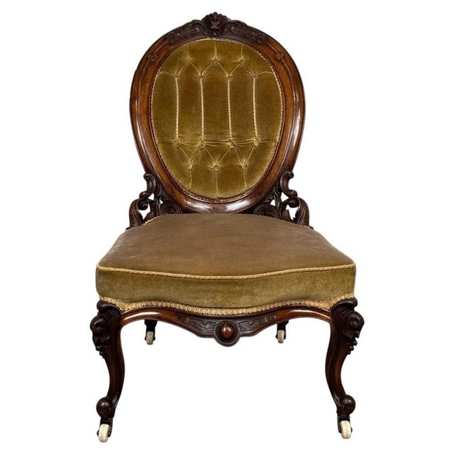 A fine 19th-century English nursing armchair, beautifully crafted in walnut and distinguished by its elegant proportions,...